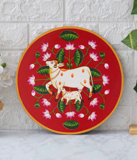 Pichwai Painting: This beautiful pichwai painting features a mother cow and her calf, a timeless symbol of nurturing love
